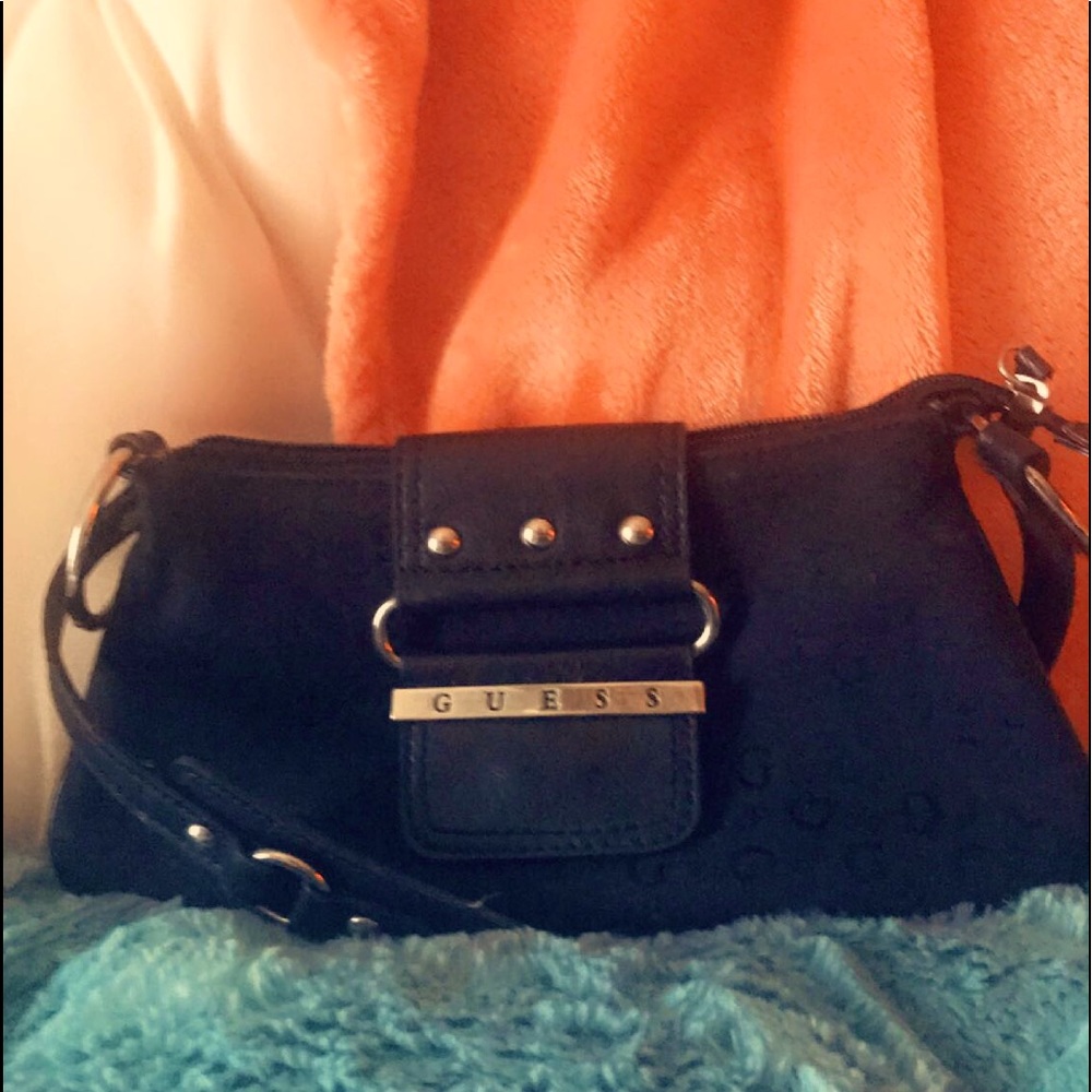 Small Guess brand clutch, black.